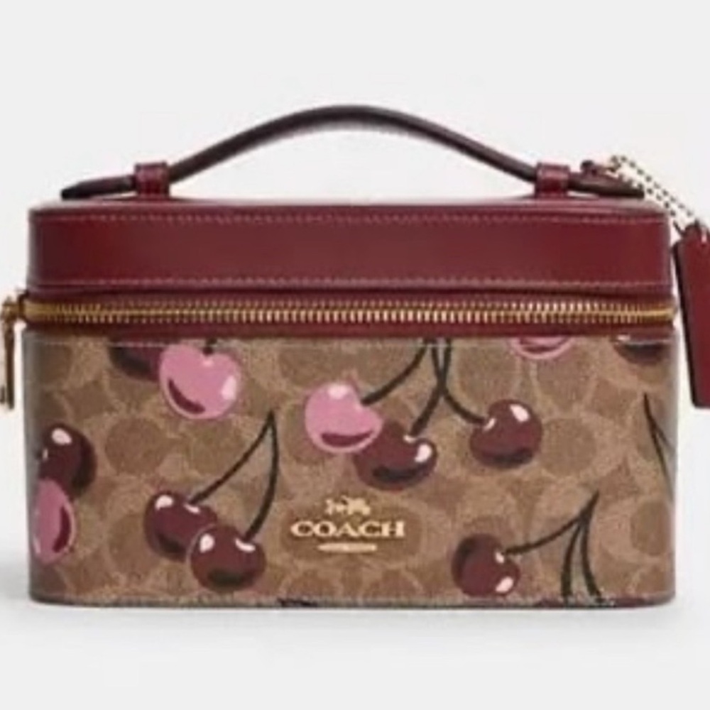 SOLD
NWT Coach Cosmetic Case In Signature
Canvas With Cherry Print 🍒